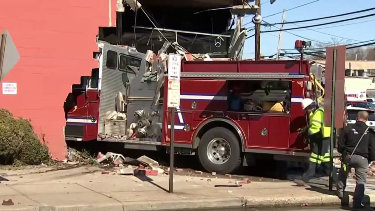 Firetruck slams into Long Island furniture store after swerving to