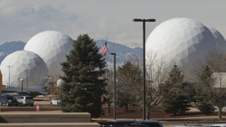 These giant white structures called radomes at Buckley Space Force Base in Colorado house massive satellite dishes.