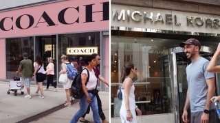 Pedestrians walk past a Coach store and a Michael Kors store.