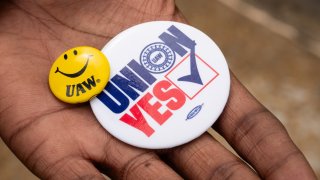 FILE -- Kelcey Smith displays UAW buttons in Chattanooga, Tennessee on April 10, 2024. 