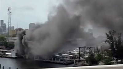 Video shows crews battling large boat fire on Miami River