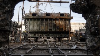 Workers uninstall a transformer which was destroyed after a Russian missile attack at DTEK's power plant in Ukraine