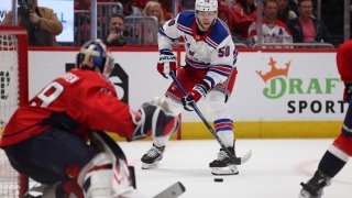 New York Rangers left wing Will Cuylle (50) shoots during the second period in Game 4 of an NHL hockey Stanley Cup first-round playoff series against the Washington Capitals, Sunday, April 28, 2024, in Washington. (AP Photo/Tom Brenner)