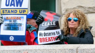 Casino workers in favor of banning smoking in Atlantic City demonstrate outside a courthouse