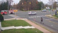 Watch: Toddler running toward busy intersection saved by two men