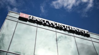 East West Bank signage is displayed outside of bank branch in Beverly Hills, California on May 4, 2023. 