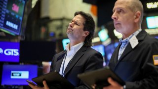 Traders work on the floor at the New York Stock Exchange on May 8, 2024.