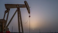 Oil prices hold firm as crude inventories fall and U.S. inflation eases
