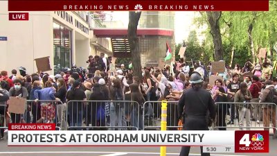 Protests underway at Fordham University as cops in riot gear stand nearby
