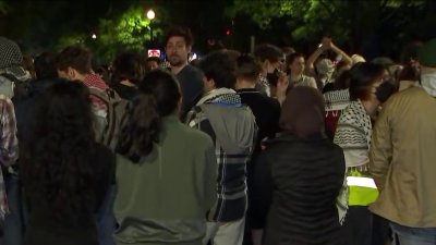 Students protest outside GW president's home