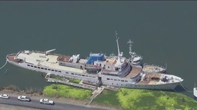 Sinking ship in Delta waterway in San Joaquin County leaking fuel, oil