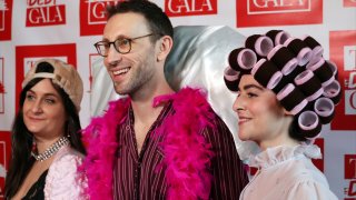 Debt Gala co-founders, from left, Molly Gaebe, Tom Costello and Amanda Corday, appear at the Debt Gala in the Brooklyn borough of New York on Sunday, May 5, 2024. Some 200 attendees sought to help alleviate medical debt at the second annual benefit, one of several alternative fundraisers that have popped up around the star-studded Met Gala. (AP Photo/James Pollard)