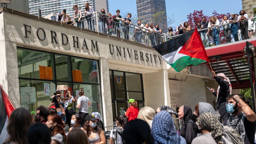 NEW YORK, NEW YORK – MAY 01: Pro-Palestinian protesters gather outside Fordham’s Lincoln Center campus after a group created an encampment inside the building on May 01, 2024 in New York City. The occupation of the building comes a day after the police raided both Columbia University and City College arresting dozens and closing down encampments in support of Palestine.   (Photo by Spencer Platt/Getty Images)