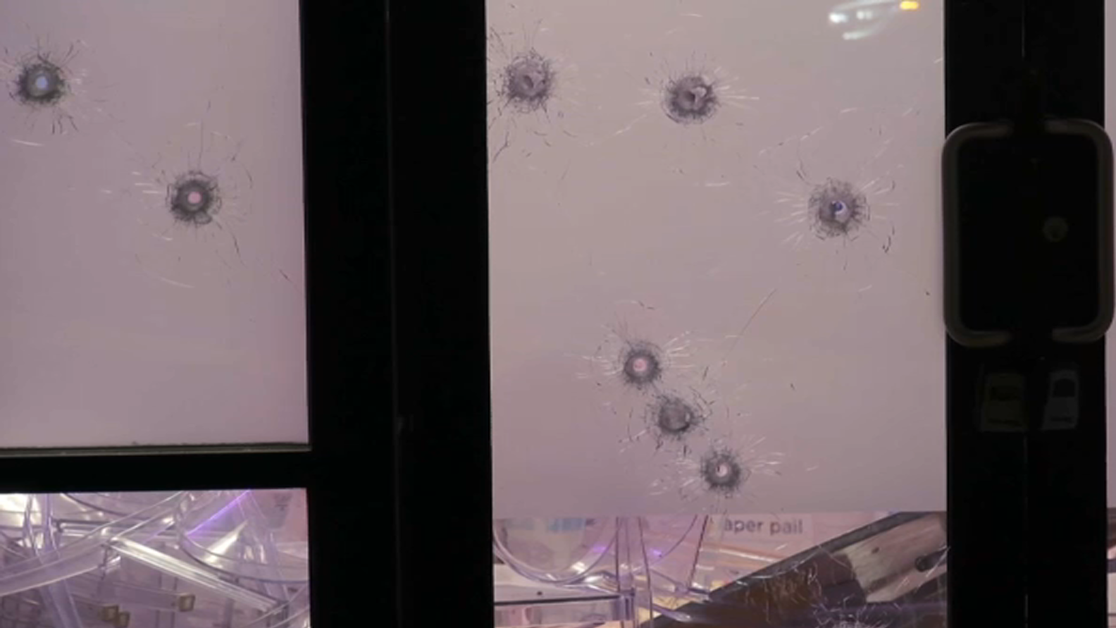 Bullet holes in glass of Queens party venue