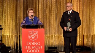 Joan Payden (L) and Lt. Col. John M. Chamness (R) speak onstage at The Salvation Army 2019 Sally Awards at the Beverly Wilshire Four Seasons Hotel on June 19, 2019 in Beverly Hills, California.