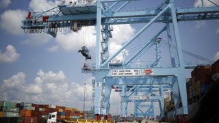 Gantry cranes stand in the APM Terminals yard at the Port of Mobile in Mobile, Alabama, U.S., on Thursday, July 20, 2017. 