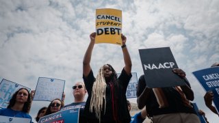 D’Aungilique Jackson, of Fresno, California, holds a “Cancel Student Debt” sign outside the U.S. Supreme Court in Washington, D.C., after the nation’s high court struck down President Joe Biden’s student debt relief program on Friday, June 30, 2023.