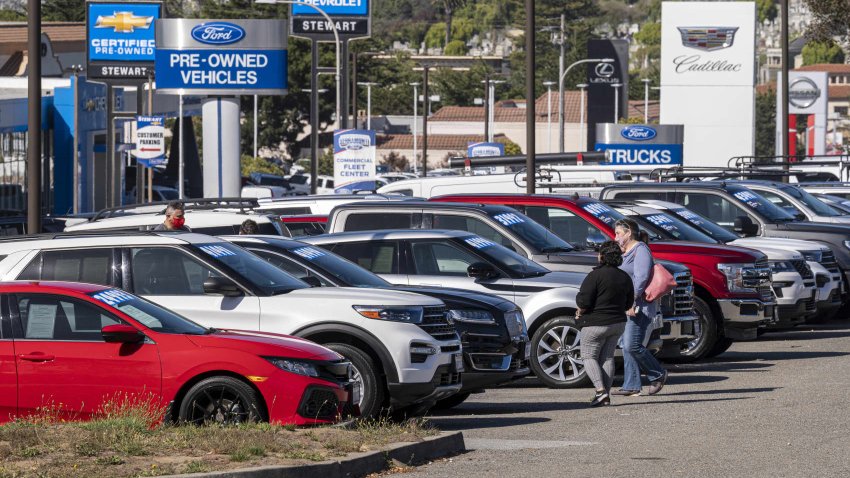 Customers at a Ford dealership in Colma, California, on July 22, 2022.