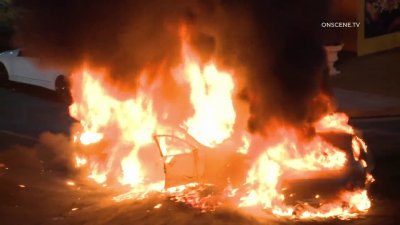 Cars go up in flames at downtown LA street takeover
