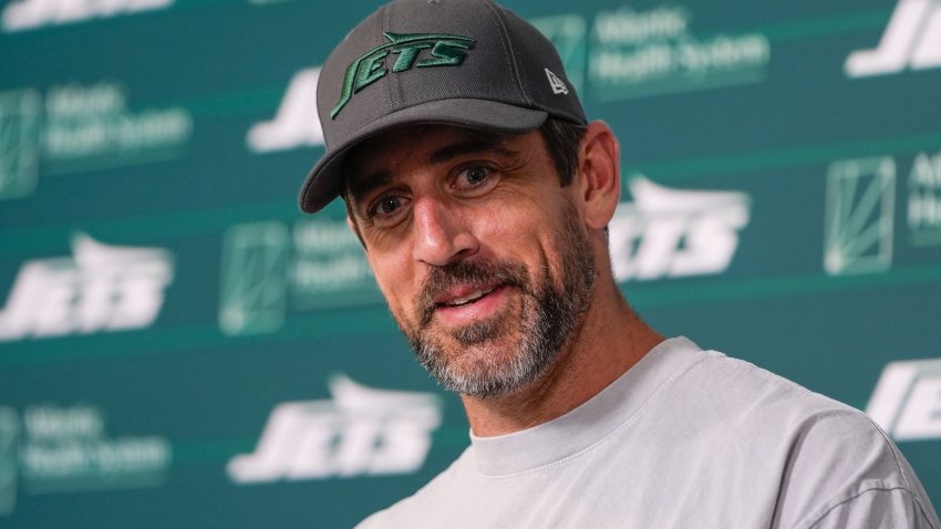 New York Jets quarterback Aaron Rodgers talks to reporters after a practice at the NFL football team’s training facility in Florham Park, N.J., Tuesday, May 21, 2024. (AP Photo/Seth Wenig)