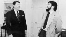 In this photo provided by the White House, President Ronald Reagan called Associated Press Washington, D.C., staff photographer Ron Edmonds into the Oval Office to congratulate him on winning the Pulitzer Prize, April 13, 1982. Edmonds was honored for his spot news picture coverage of the 1981 assassination attempt on Reagan. Edmonds died Friday, May 31, 2024, in Virginia at age 77. (AP Photo/White House/Michael Evans)