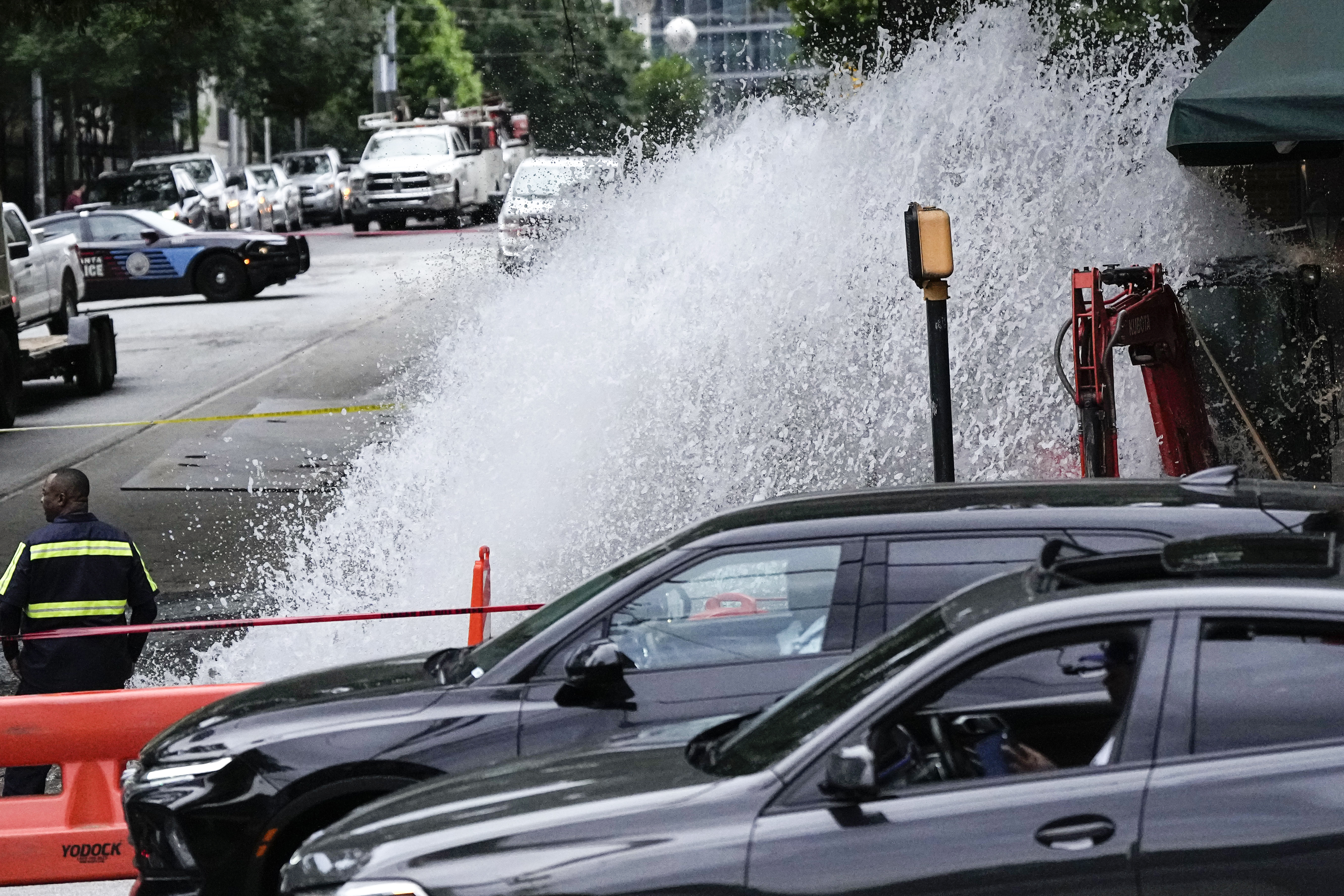 Water gushes out of a broken water transmission line in downtown Atlanta