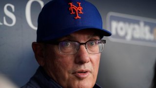 FILE - New York Mets owner Steve Cohen talks to the media in the dugout before a baseball game against the Kansas City Royals, Aug. 2, 2023, in Kansas City, Mo. Cohen says his team can still turn around its season and fans “have been through worse." Cohen praised his front office and manager Carlos Mendoza during a news conference before the final of the two-game London Series, Sunday, June 9,. 2024. (AP Photo/Charlie Riedel)