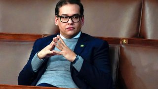 George Santos sat down in a chair waiting to start the session at the House chamber as the House meets for the fourth day to elect a speaker and convene the 118th Congress in Washington, Jan. 6,