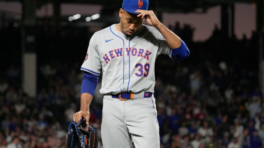 New York Mets relief pitcher Edwin Díaz reacts after being ejected by their base umpire Vic Carapazza during the ninth inning of a baseball game against the Chicago Cubs in Chicago, Sunday, June 23, 2024.