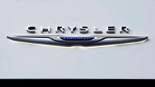 FILE - The Chrysler logo is on display at the Pittsburgh International Auto Show, Feb. 11, 2016, in Pittsburgh.