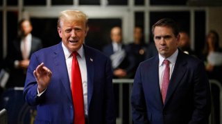 Former President Donald Trump speaks to reporters Thursday accompanied by his lead attorney Todd Blanche at Manhattan criminal court.