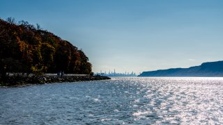 TARRYTOWN, NEW YORK – NOVEMBER 14: The New York City skyline is viewed looking down the Hudson River with the George Washington Bridge in the front on November 14, 2020 in Tarrytown, New York.