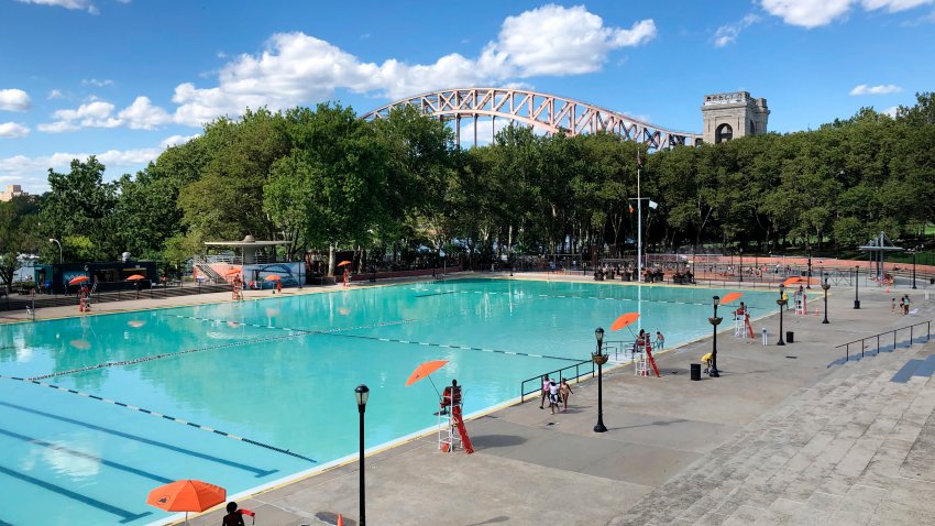 Lifeguards getting ready at Astoria Pool in Astoria Park, Queens, New York