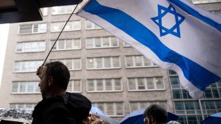 Protesters gather outside New York's Israeli Consulate to rally against Prime Minister Netanyahu on March 27, 2023 in New York City. (Photo by Alexi Rosenfeld/Getty Images)