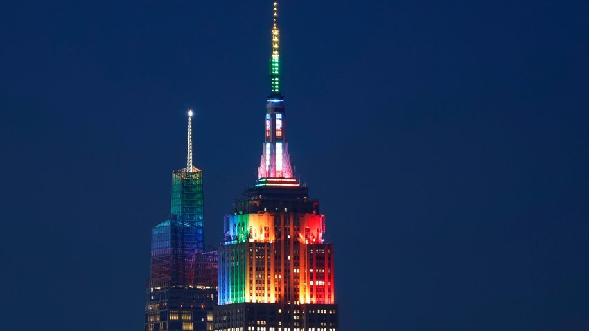 JERSEY CITY, NJ – JUNE 25: The Empire State Building and One Vanderbilt are illuminated in rainbow colors to mark Pride Day in New York City on June 25, 2023, as seen from Jersey City, New Jersey.