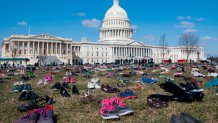 The lawn outside the US Capitol is covered with 7,000 pairs of empty shoes to memorialize the 7,000 children killed by gun violence since the Sandy Hook school shooting, in a display organized by the global advocacy group Avaaz, in Washington, DC, March 13, 2018. / AFP PHOTO / SAUL LOEB (Photo credit should read SAUL LOEB/AFP via Getty Images)