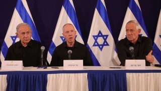 FILE - From left, Israeli Prime Minister Benjamin Netanyahu, Defense Minister Yoav Gallant and Cabinet Minister Benny Gantz speak during a news conference in the Kirya military base in Tel Aviv, Israel on Oct. 28, 2023.