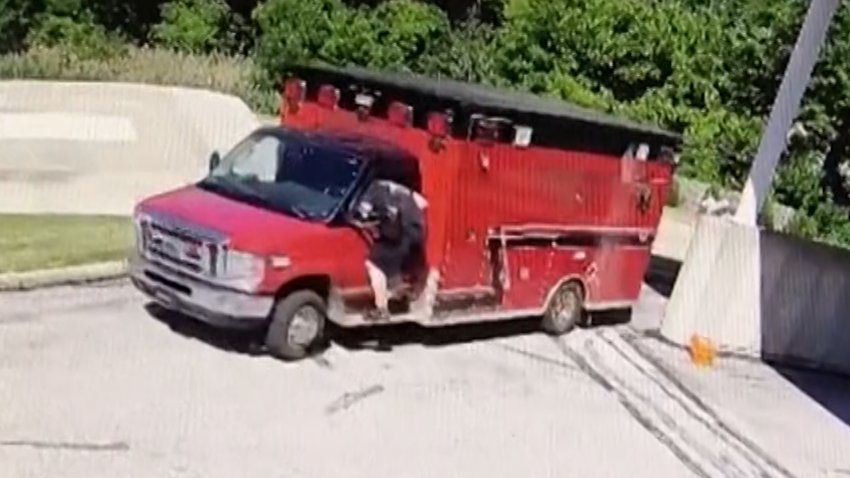 Firefighter jumping onto ambulance in Ohio.