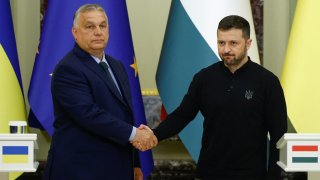 Hungary’s Prime Minister Viktor Orban and Ukrainian President Volodymyr Zelenskyy shake hands after a joint news briefing, amid Russia’s attack on Ukraine, in Kyiv, Ukraine July 2, 2024.