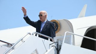 US President Joe Biden waves as he boards Air Force One at Joint Base Andrews in Maryland on July 5, 2024. Biden is traveling to Madison, Wisconsin, for a campaign event. 