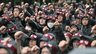 Members of the National Samsung Electronics Union stage a rally as they begin a three-day general strike outside the company’s foundry and semiconductor factory in Hwaseong on July 8, 2024.