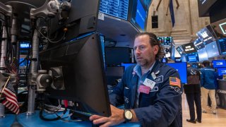 Traders work on the floor of the New York Stock Exchange (NYSE) on July 11, 2024 in New York City. 