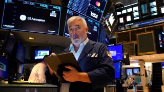 A trader works on the floor of the New York Stock Exchange (NYSE) in New York City on July 22, 2024.