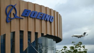 A logo is seen on the Boeing stand on the opening day of the Farnborough International Airshow 2024, south west of London, on July 22, 2024.