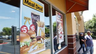 A sign advertises meal deals at a McDonald’s restaurant on July 22, 2024 in Burbank, California.