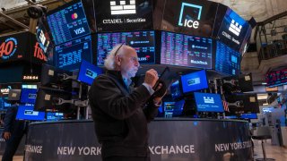 Traders work on the floor of the New York Stock Exchange (NYSE) on July 24, 2024 in New York City.