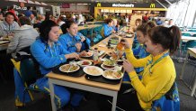 Members of the Swedish Woman's Hockey team eat