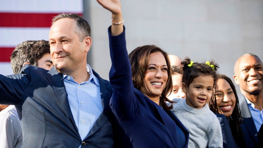 Doug Emhoff and Kamala Harris wave