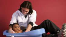 Lionel Messi bathing baby Lamine Yamal
