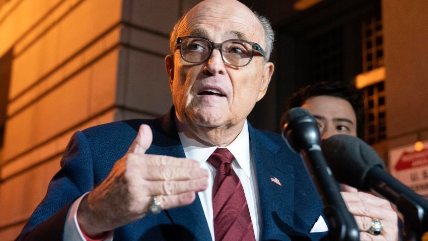 FILE – Former New York Mayor Rudy Giuliani talks to reporters as he leaves the federal courthouse in Washington, Dec. 11, 2023. A judge said Wednesday, July 10, 2024, he was leaning toward throwing out Giuliani’s bankruptcy case after lawyers and his biggest creditors agreed this was the best way forward. (AP Photo/Jose Luis Magana, File)